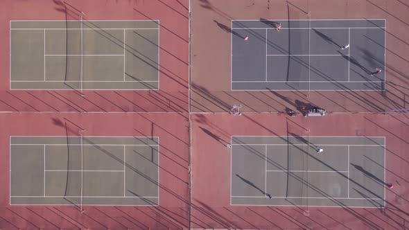 Aerial View of People Seen Playing Tennis