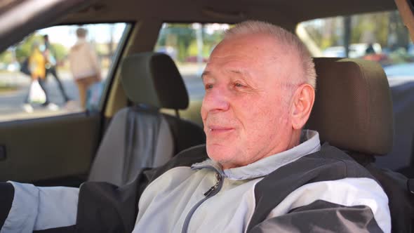 Caucasian Elderly Man Using Car, Active Happy Retirement. Traveling Alone on Pension  alt