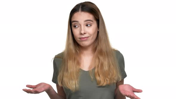 Portrait of Indifferent Woman Throwing Up Hands Meaning Lack of Information or Have No Clue Isolated alt