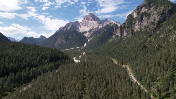 Aerial view of the green mountains forest in Dolomites, Italy alt