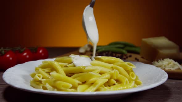 White Sauce Poured On Penne Pasta 63