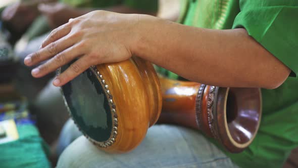 Focused Shot of Man's Arms As He Plays the Thai Hand Drums alt