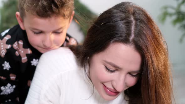 Mom with Children Write a Letter to Santa Claus alt