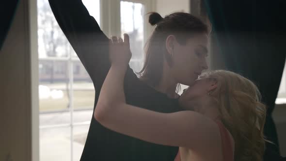 Pretty Blonde and Her Boyfriend are Hugging and Caressing Each Other Medium Portrait alt