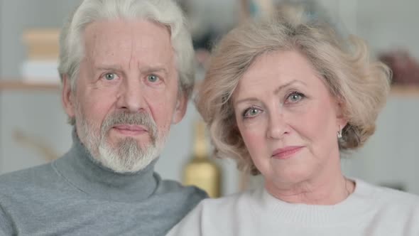 Serious Old Couple Looking at Camera alt