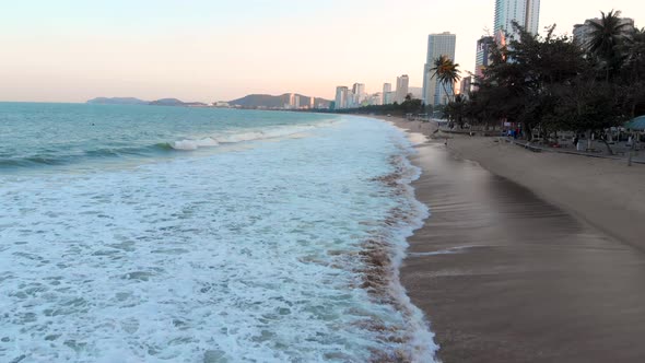 Shooting From an Aerial Drone Against the Backdrop of an Orange Sunset Overlooking the Ocean Sea alt