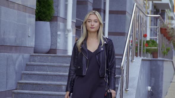 Beautiful Girl Walking the City Street alt