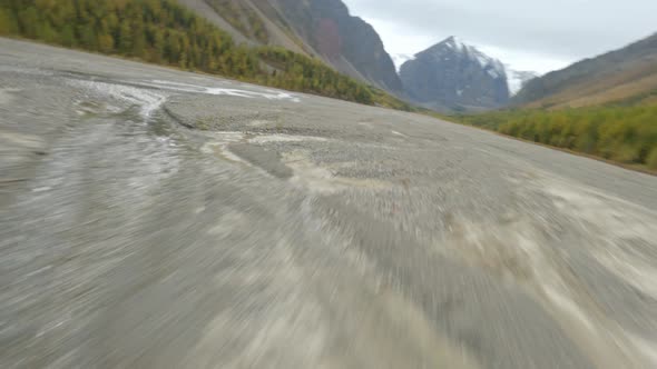 FPV Sports Drone Speed Low Flight Over Beds Mountain River and Make Trick Roll alt