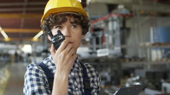 Female Engineer Giving Instructions on Radio alt