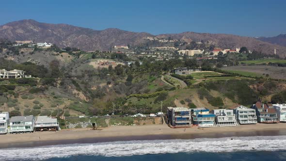 Aerial drone view of expensive and luxurious properties over the hilly terrain close the beautiful s alt