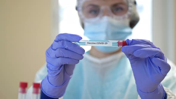 Professional Female Scientist Wearing Glasses Mask Holds 2019Ncov Coronavirus Vaccine Sample Her alt