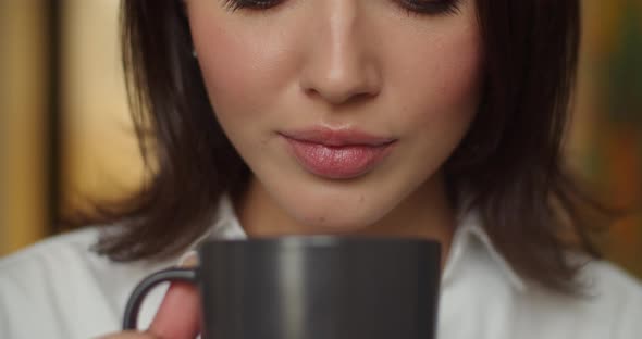 Detailed Macro Shot Female Face Drinking Hot Tea Indoors Slow Motion