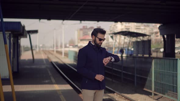 Man Waiting Tram On Tram Station.Businessman Standing On Railway Train Station Platform.City Tourist alt
