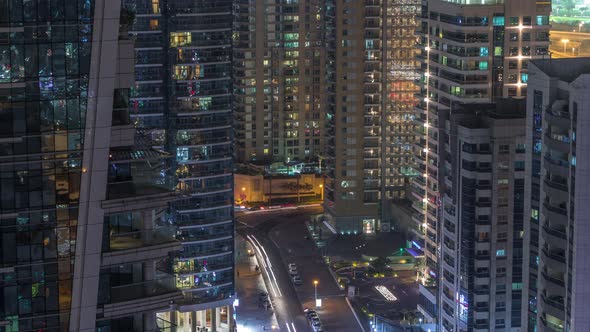 View of Various Skyscrapers and Towers in Dubai Marina From Above Aerial Night Timelapse alt