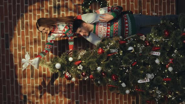 Vertical Video of Happy Couple Preparing for New Year Winter Holidays Celebration Concept alt