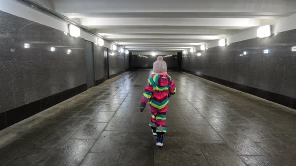 Little Independent Kid Walking Alone in Undeground Walkway alt