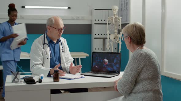 General Practitioner and Patient Analyzing Covid 19 Virus Animation alt