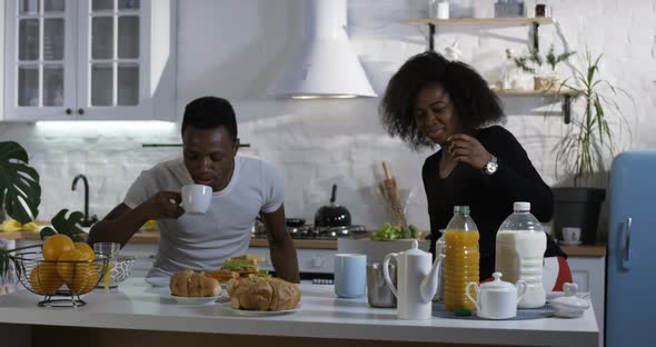 Man and Woman Talking During Breakfast alt