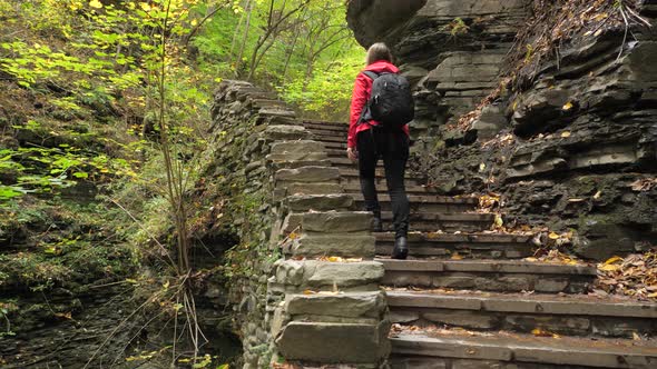 Female Tourist Walking Up Stairs At Watkins Glen State Park Natural Gorge 01