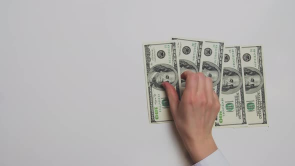 The Hand Puts Dollars on the Table alt