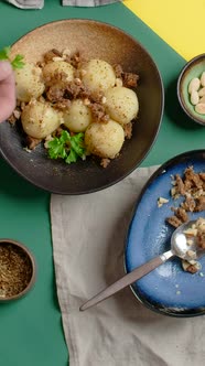 Vertical Flat Lay Video Chef Adds Parsley to the Potato Gnocchi