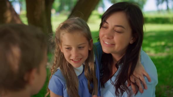 Children Hugging Happy Mother Close Up alt