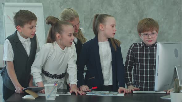 Kid Business Team Working in the Office Together with Computer alt