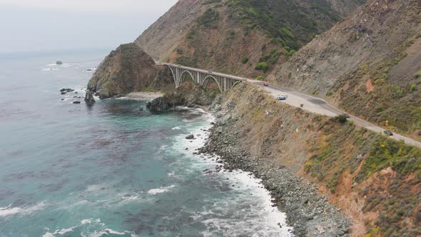 Aerial Drone Shot of a Bridge and Overlook a Steep Coastal Road (Big Sur, Pacific Coast Highway, CA)
