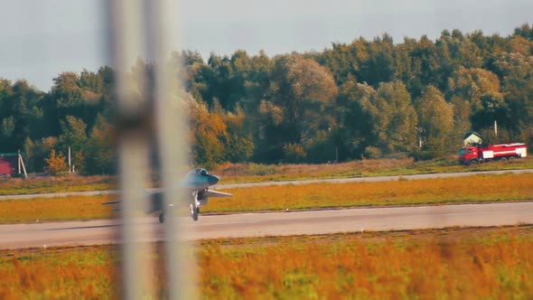 A Reactive Fighter Plane Taking Off the Runway alt