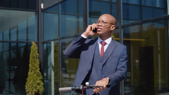 Young Male Office Worker Talking on the Phone alt