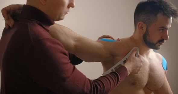 Kinesiologist Does Miofascial Release Therapy with Stainless Steel IASTM Tool for His Patient alt