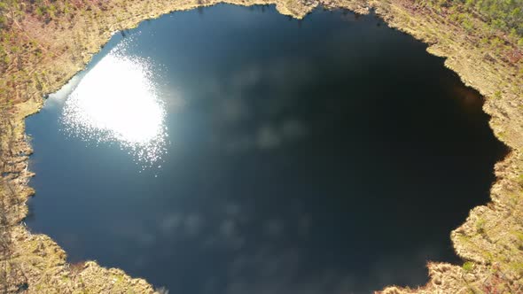 AERIAL: Reflections of Sun Playing on the Surface of Lake in Lithuania