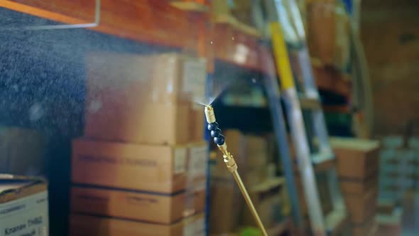 Spray Gun Closeup. Man Disinfects Inside the House. Coronavirus. Covid-19 Mers. alt