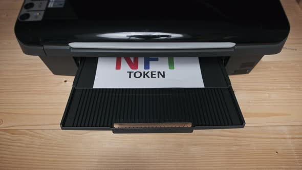 NFT Token Printing Inscription on White Sheet of Paper Printed By a Jet Printer alt