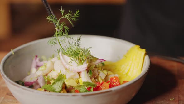 Professional chef with fine dinning plating skill, finalised the traditional peruvian seafood salad, alt