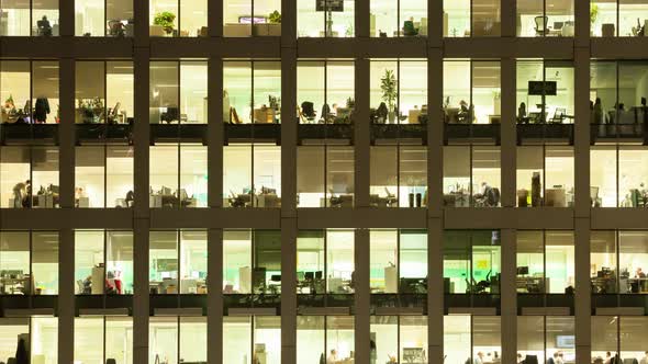 Timelapse of the exterior of an office block at night