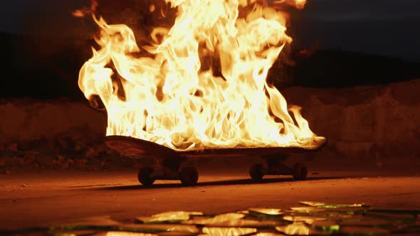 Burning skateboard at night alt