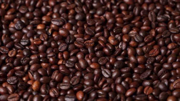 Close Up of Roasted Brown Coffee Beans Rotating alt