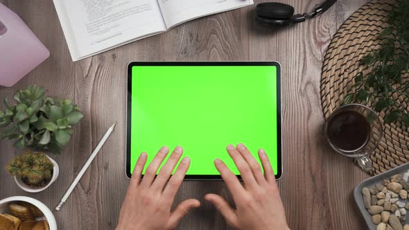 Horizontal Orientation Tab with Green Screen. Top View. Hands Typing Message. alt