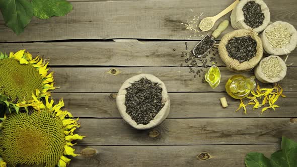 Sunflower Oil and Seeds on an Old Wooden Table. Flat Lay. alt