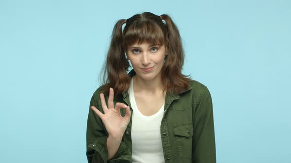 Slow Motion of Young Caucasian Woman with Double Ponytails Hairstyle Showing Different Variants of