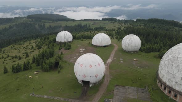 Flying over abandoned USSR radar station in the carpathian mountains. Aerial. alt