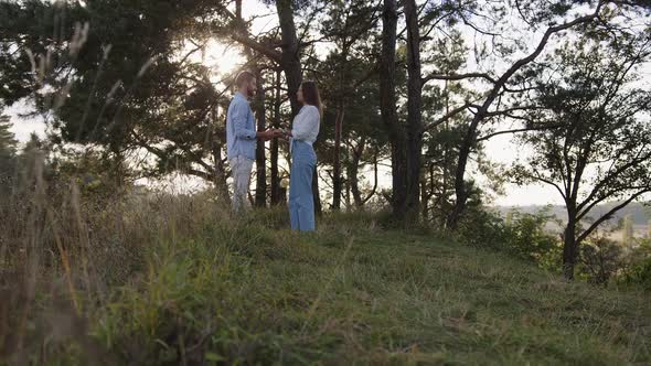 Closeup of Man and a Wooman That Joining Hands Together on Nature Background