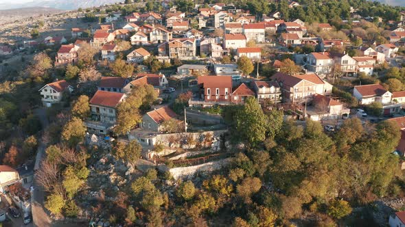 Houses on a rocky hill - suburban neighborhood on the hillside. Illegal residential settlement alt