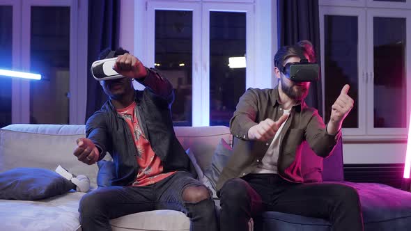 Men which Having Video Racing Competition Using Augmented Reality Glasses alt