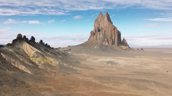 Vehicle Along Dusty and Dirty Path Stretching Within the Desert Around Shiprock alt