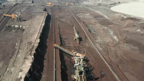 Flight Over the Quarry with Heavy Bucket Wheel Excavators Mining a Coal alt