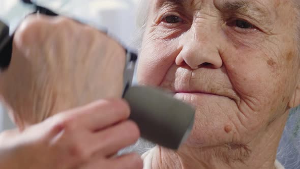 Elderly Woman Doing Dumbbell Curls 