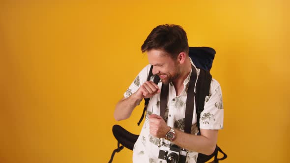 Dancing Happy Backpacker - Caucasian Bearded Traveler. Holidays and Travel Concept alt