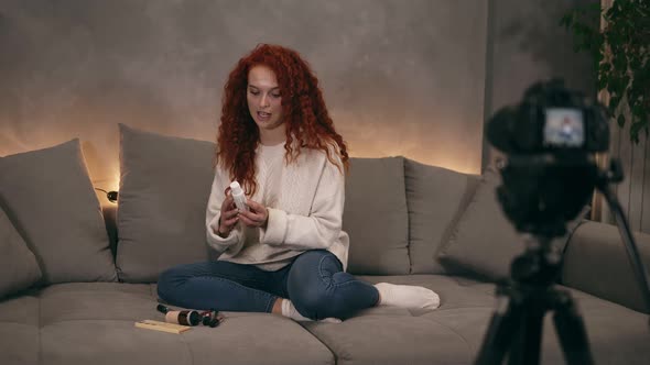 Curly Red Headed Young Girl Vlogger is Talking in Front of Camera Recording Video for Online Blog in alt